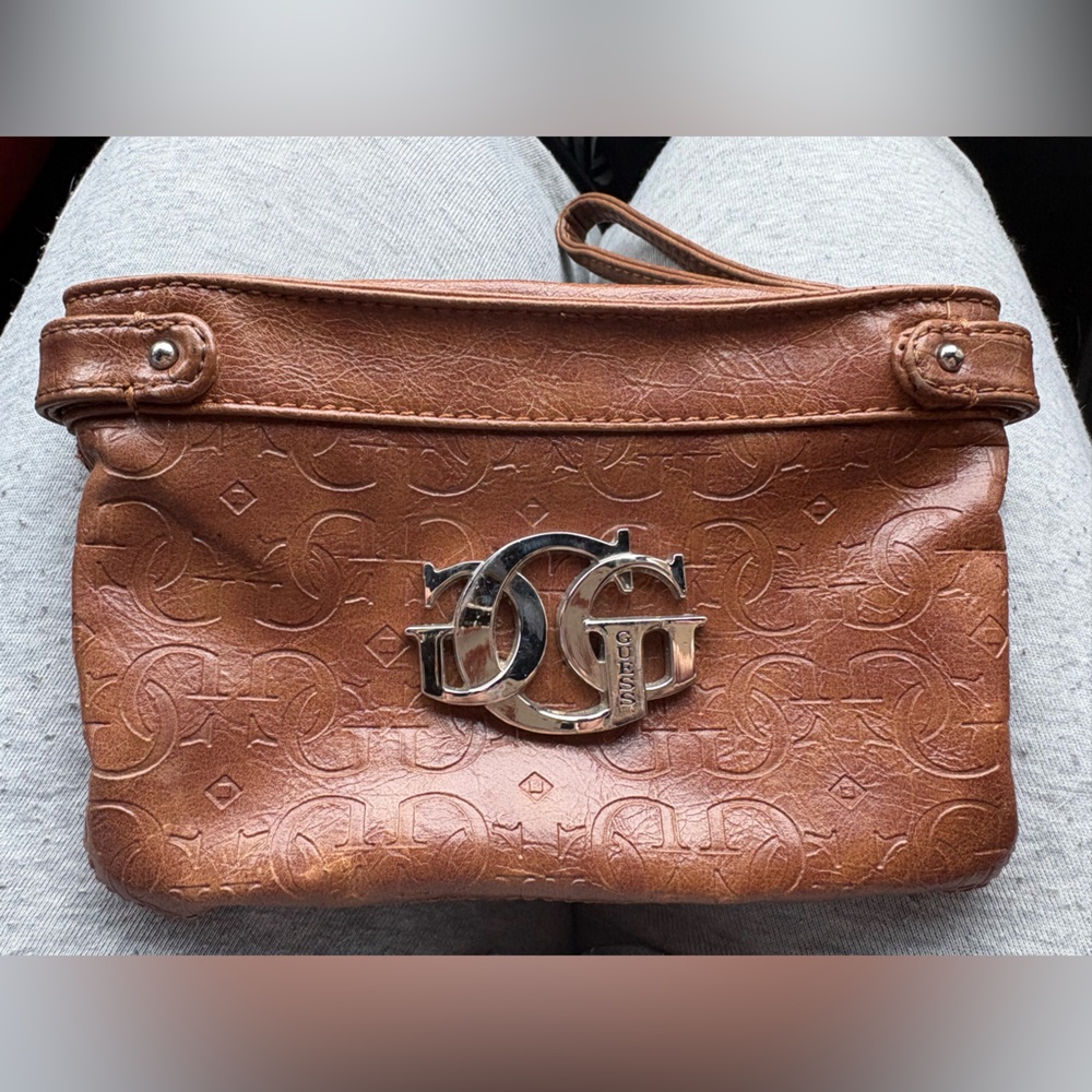 Brown guess wristlet